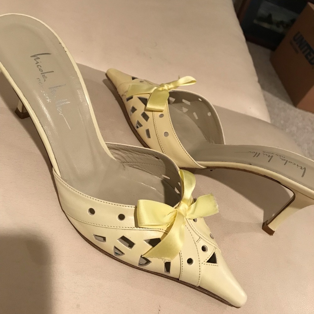 Beautiful yellow heeled mules.